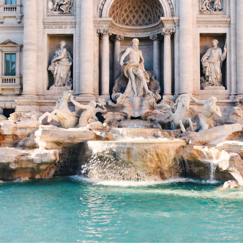 Visit the iconic Trevi Fountain, a short walk away