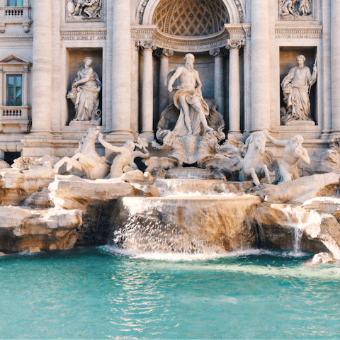 Visit the iconic Trevi Fountain, a short walk away