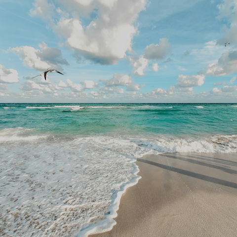 Feel your toes in the sand, just moments from the door