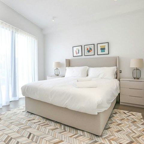 Throw open the windows and let the breeze wash over you from your plush bed