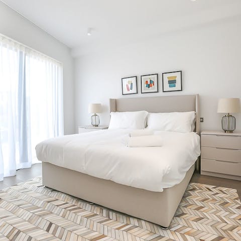 Throw open the windows and let the breeze wash over you from your plush bed