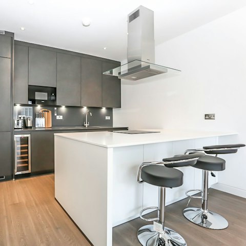 Perch at your kitchen bar to enjoy a glass of chilled natural wine from your wine cooler