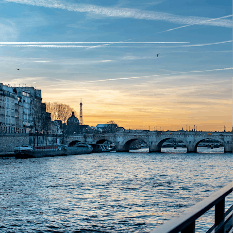 Enjoy a sunset stroll along the Seine