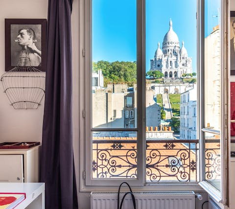 Take in unbeatable views of the Sacré Coeur from your bedroom