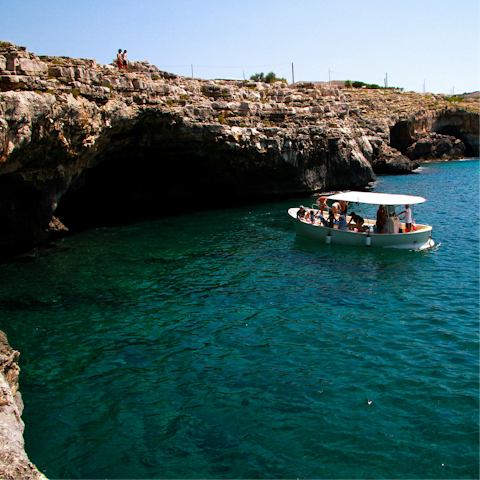 Take a boat tour of all the local grottos around Puglia's coastline