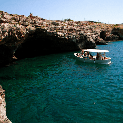 Take a boat tour of all the local grottos around Puglia's coastline