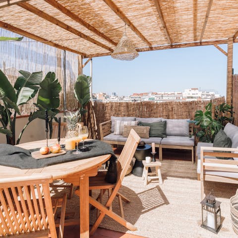 Relax and unwind on the spacious terrace with plenty of comfy seating