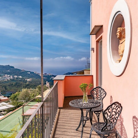 Sip cappuccino on the balcony and drink in the view of the Bay of Naples