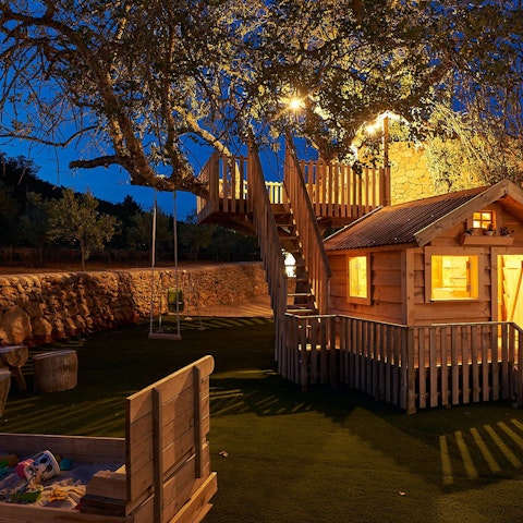 Let the kids run wild in their own tree house and play zone
