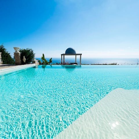 Slip into your swimwear and cool off from the Sicilian summer with a dip in the inifinity pool