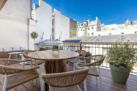 Dine alfresco above the Montmartre rooftops on a clear day