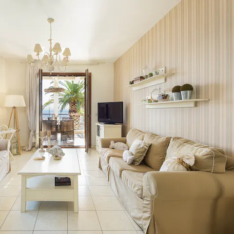 Relax in one of the comfortable living areas with its blue vistas beyond