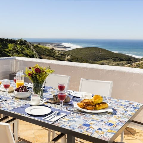 Dig into professionally prepared peixe grelhado with ocean views