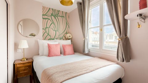 Wake up in a playfully Parisian bedroom