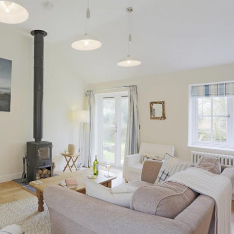 Snuggle up round the log-burning fire with a glass of wine