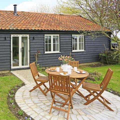 Dine outside on the sundial-shaped patio