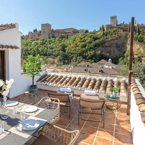 Admire the incredible views of the Alhambra from the roof terrace