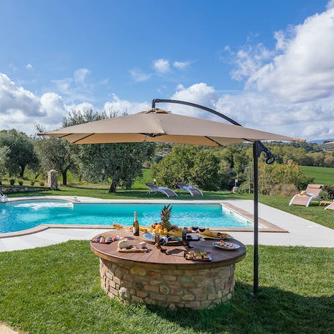 Enjoy poolside drinks and canapés