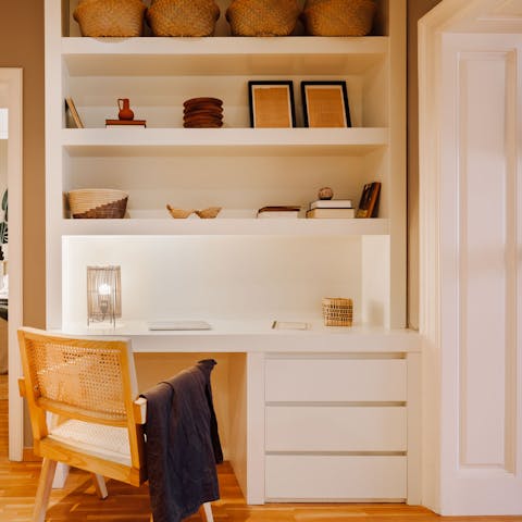 Catch up on laptop duties in the elegant workspace