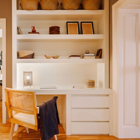 Catch up on laptop duties in the elegant workspace