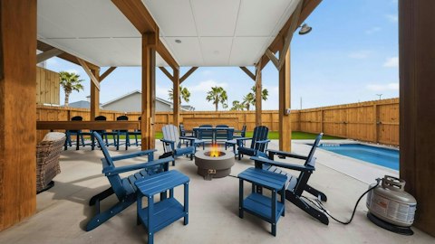 Linger outdoors on mild evenings beside the glowing pool