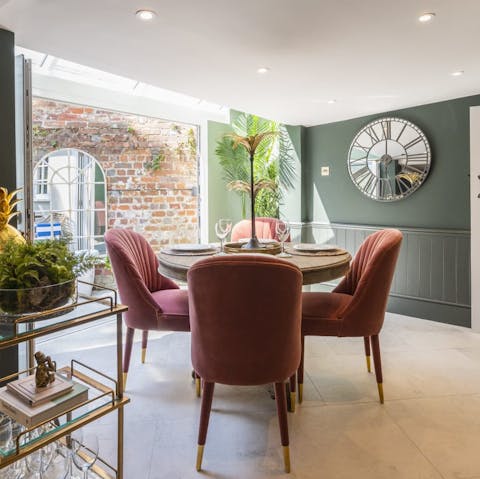 Enjoy atmospheric evenings gathered around the elegant dining table