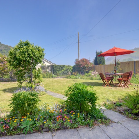 Dine amongst fruit trees and flowers in the cottage garden