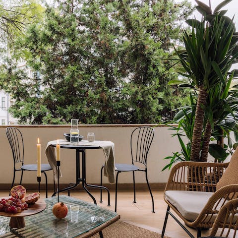 Relax on the balcony and watch the city buzz below you