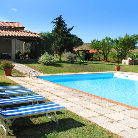 Sunbathe on the beds next to the pool
