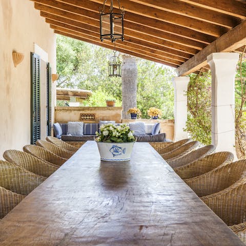 Gather round the outdoor dining table for a shaded alfresco lunch
