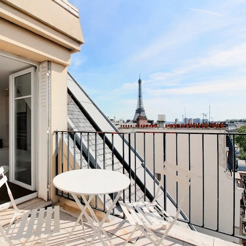Watch the Eiffel Tower sparkle at night from the private balcony