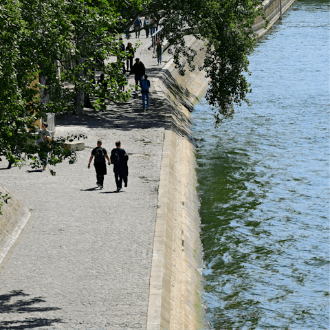 Grab a coffee and stroll along the Seine, a ten-minute walk away
