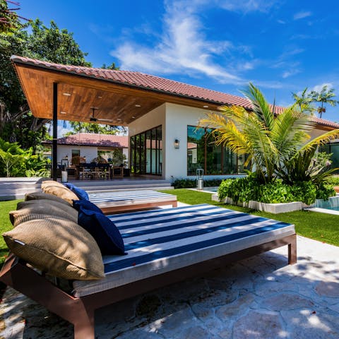 Lounge around the pool on the day beds for mornings of relaxation before heading to Miami Beach, just a twenty-minute drive away