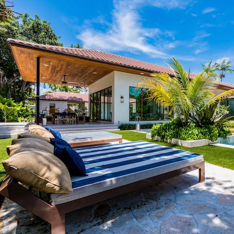 Lounge around the pool on the day beds for mornings of relaxation before heading to Miami Beach, just a twenty-minute drive away