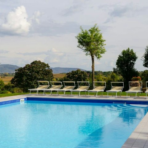 Lounge poolside and admire the countryside views