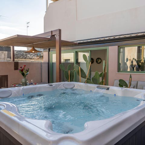 Soak in the hot tub under the stars