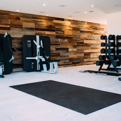 Keep your fitness schedule up in the on-site gym after visiting the pizza shack