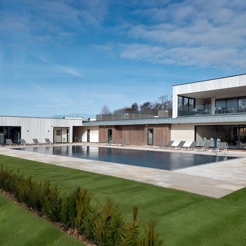 Kick your feet up at the shared pool before a bike ride around the grounds