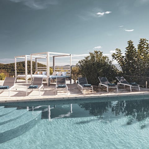 Plunge into the private pool and dry of on a day bed