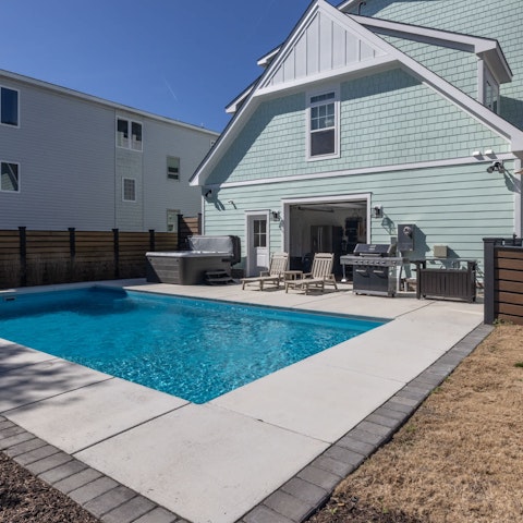 Enjoy leisurely afternoons relaxing by the pool