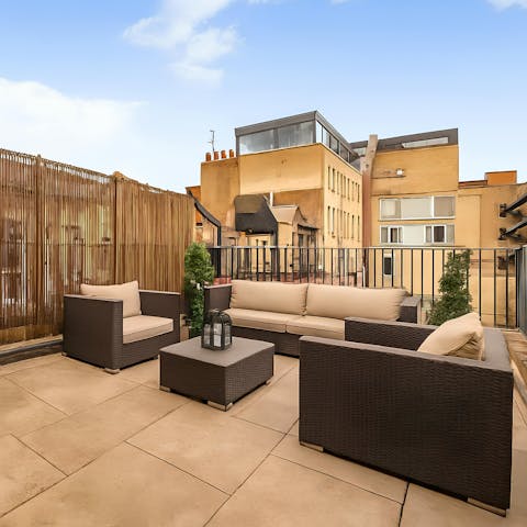 Relax with a drink on your own private terrace