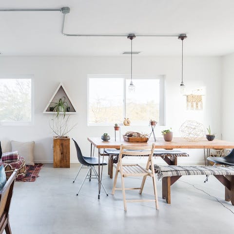 Gather your ensemble for a hearty meal in the chic dining area