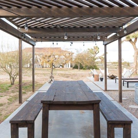 Organise alfresco meals underneath the fairy light-strewn canopy