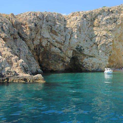 Explore the island of Krk and its beach resorts, charming villages, and rugged landscape
