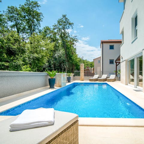 Spend blissful days lounging by the pool, soaking up the sun, and taking dips to cool off