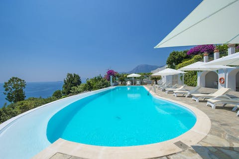 Sunbathe on the poolside before taking a refreshing dip