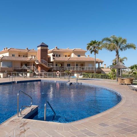 Enjoy a refreshing swim in the communal pool