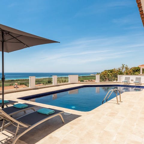 Soak up the sun on the pool terrace, promising Mediterranean Sea views