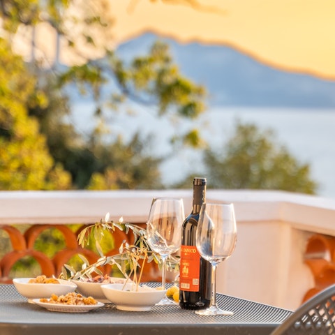 Dine alfresco and drink in the stunning sea views
