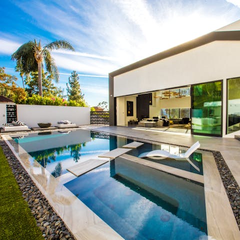 Float around the pristine pool or recline in the hot tub